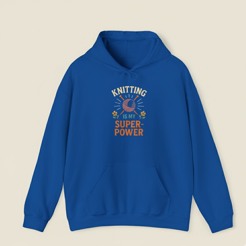 Blue hoodie with 'Knitting is my super power' text on a beige background