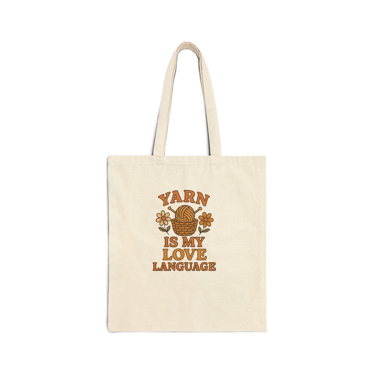 Beige tote bag with 'Yarn is my Love Language' text and yarn ball design on a white background